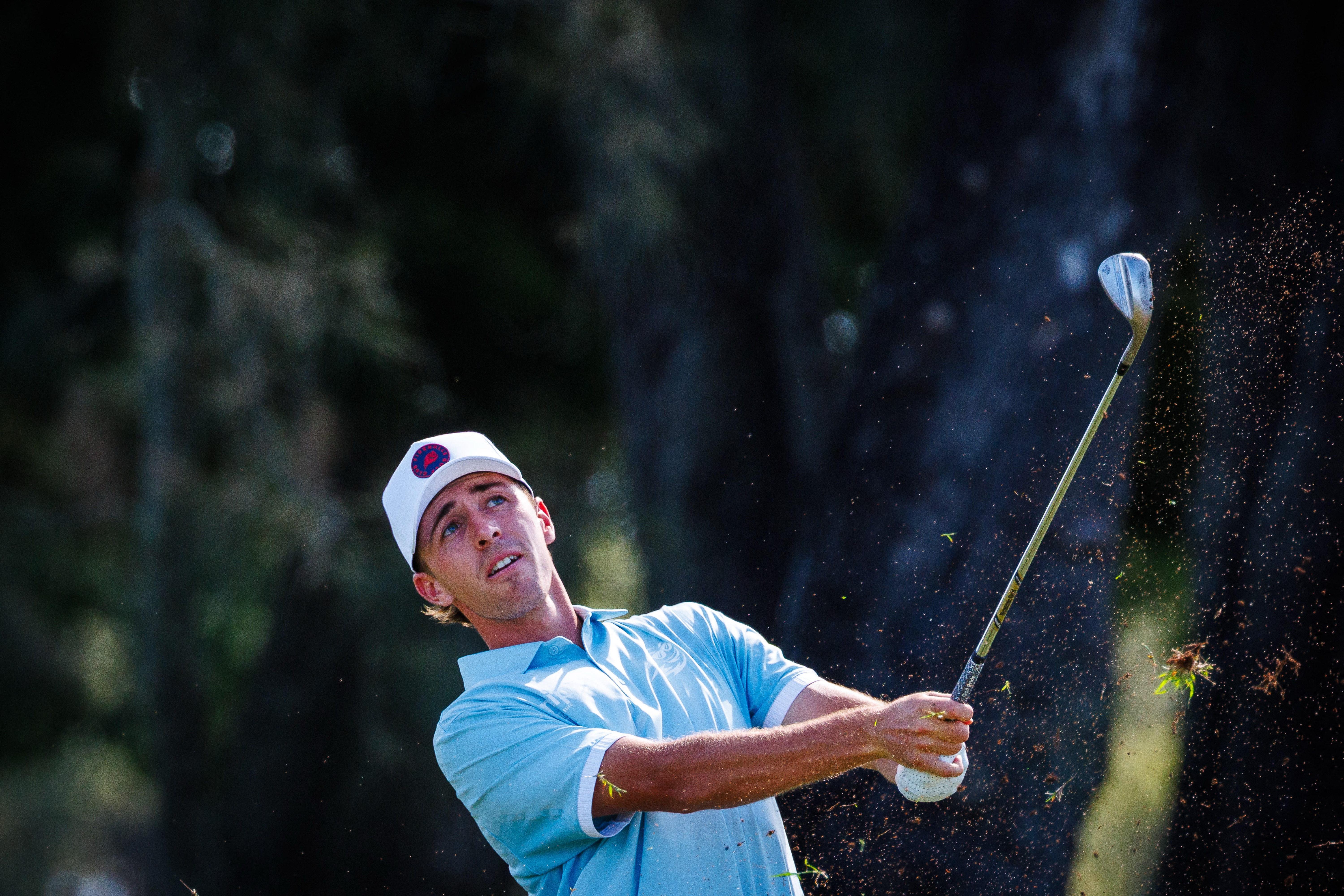 David Puig hits a wedge shot