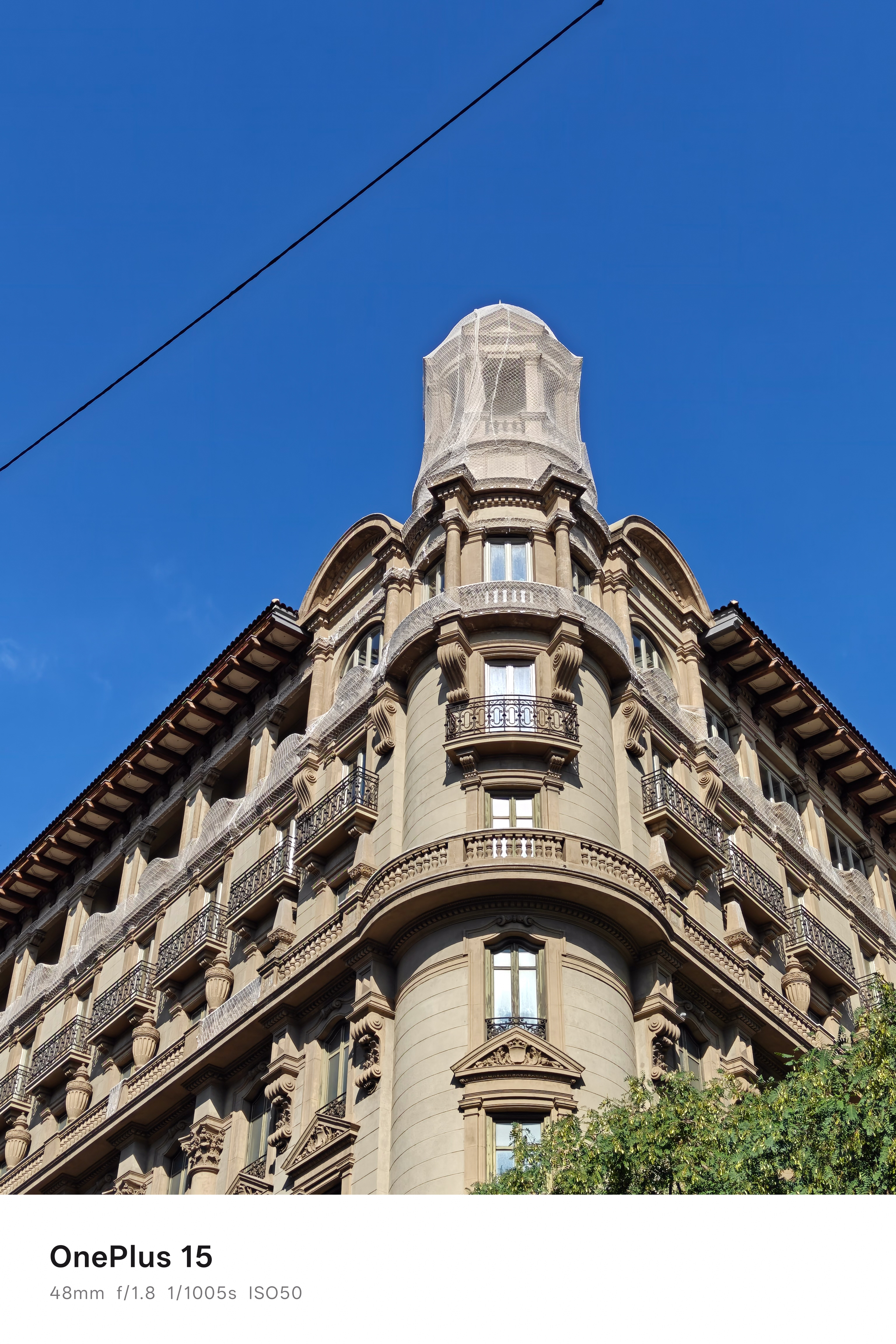 The top corner of large residential building in Barcelona, Spain