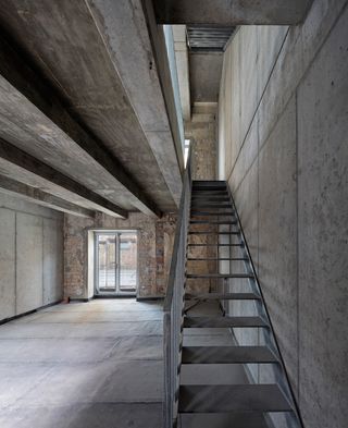 Concrete interior and stairs on right side