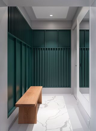 Green panelling and marble flooring