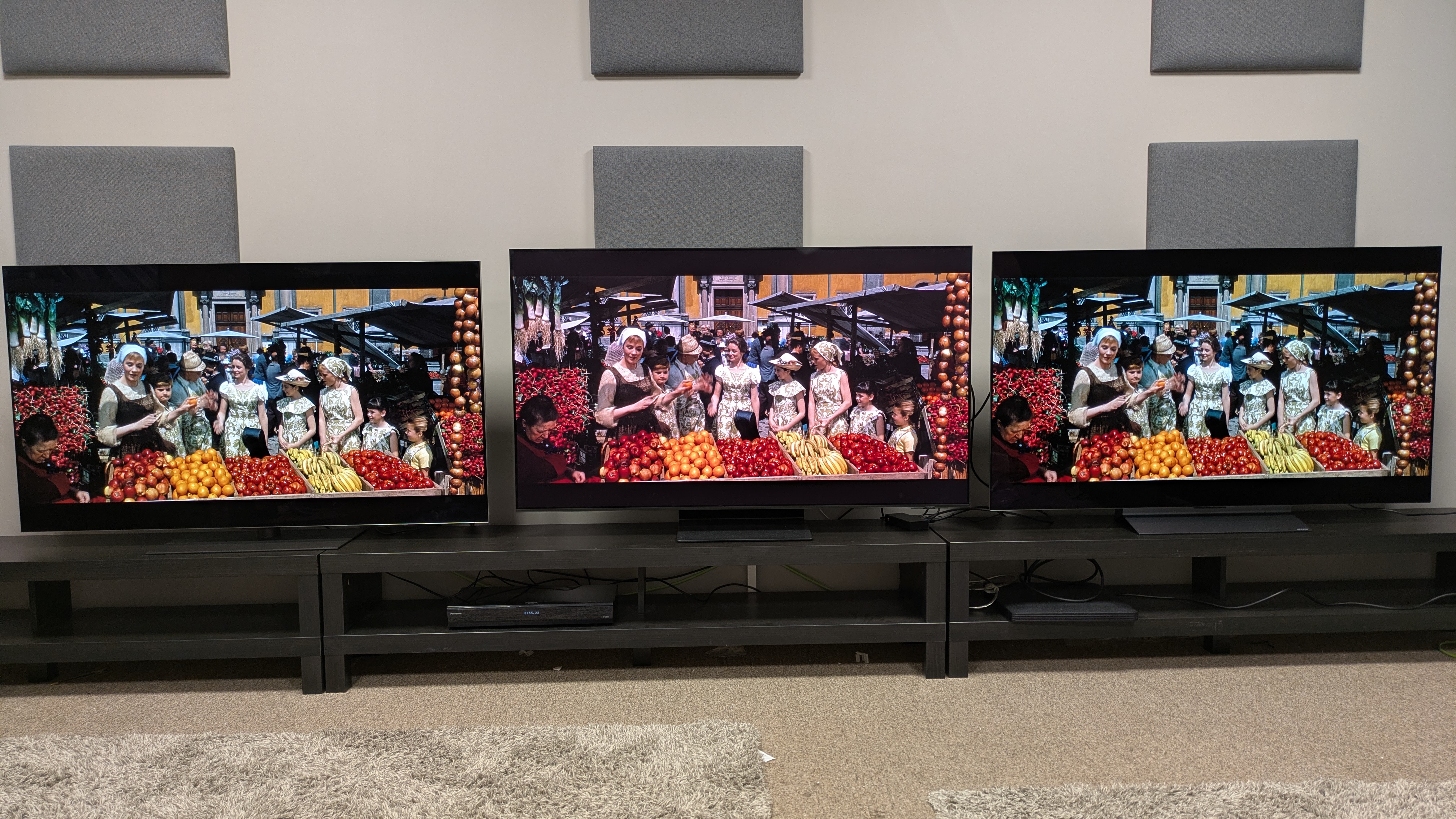 LG G5 (left) vs Samsung S95F (middle) vs LG C5 (right) showing Maria and the Von Trapp children in a market form The Sound of Music on screen