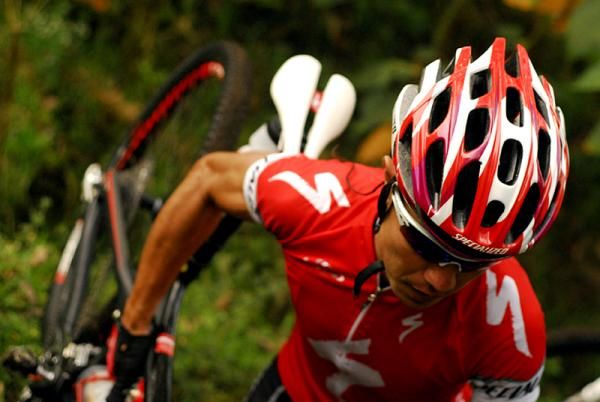 Milton Ramos carries his bike