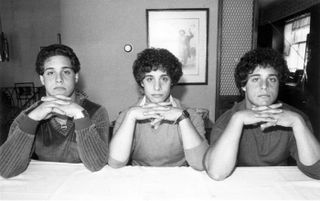 Robert Shafran, David Kellman and Eddy Galland sit for a photo at a home in Howard Beach in Queens, New York, on Sept. 28, 1980, after the triplets had been reunited.