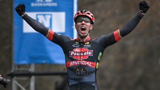 Belgian Laurens Sweeck celebrates as he crosses the finish line to win the men's elite race of the 'Flandriencross' cyclocross cycling event