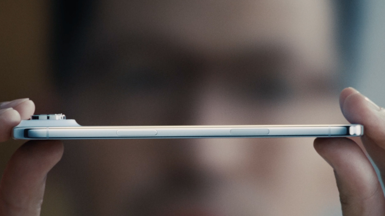 The iPhone Air side view held in a person's hands