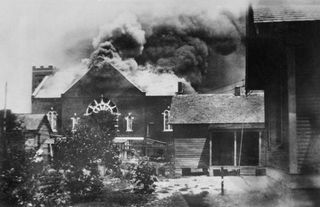 burning of church where ammunition was stored during race riot, tulsa, oklahoma, usa, american national red cross photograph collection, june 1921 photo by ghiuniversal history archiveuniversal images group via getty images