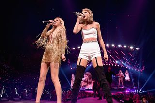 Singer/songwriters Kelsea Ballerini (L) and Taylor Swift perform onstage during The 1989 World Tour live in Nashville at Bridgestone Arena on September 25, 2015 in Nashville, Tennessee