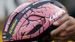 Coryn Labecki holds out a brain-designed Lazer Vento helmet