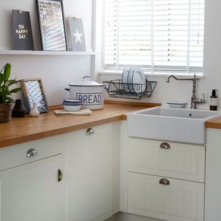 kitchen with white wall and sink