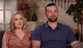 Elizabeth and Andrei sitting 90 Day Fiance: Happily Ever After? TLC