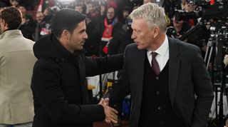 Arsenal Manager Mikel Arteta shakes hands with West Ham Manager David Moyes during the Premier League match between Arsenal FC and West Ham United at Emirates Stadium on December 26, 2022 in London, England. (Photo by David Price/Arsenal FC via Getty Images)
