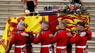 Pall bearers carry the coffin of Queen Elizabeth II