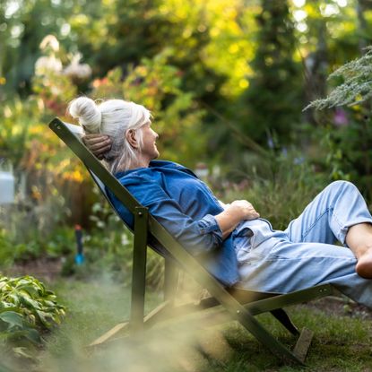 Woman relaxing in pest free garden