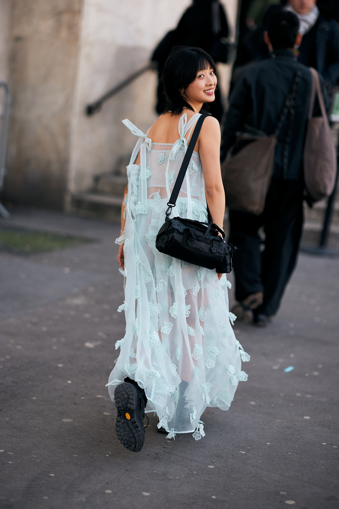 Paris Fashion Week attendees wear the glass slipper blue colour trend.