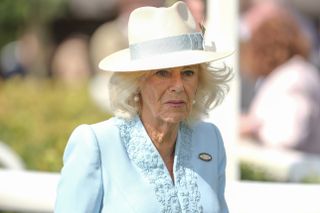 Queen Camilla attends the races to watch her horse Reaching High race in The Sky Bet Melrose Handicap at York Racecourse on August 24, 2024 in York, England.