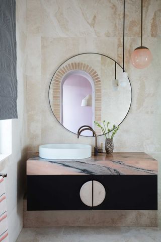 a pink marble bathroom
