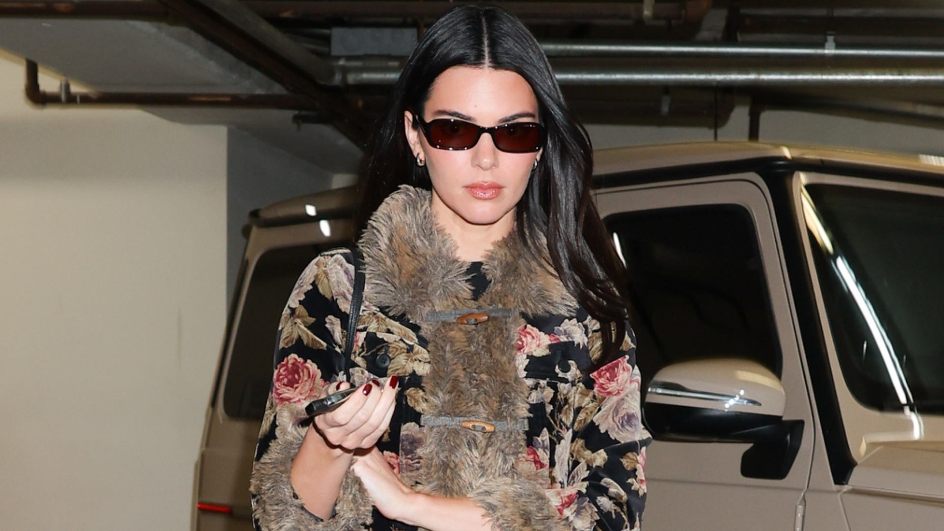 Kendall Jenner was spotted at dinner with her sister Kylie in her favorite high-vamp ballet flat trend and a vintage runway floral jacket