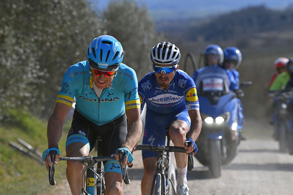 Jakob Fuglsang and Julian Alaphlippe ride toward Siena