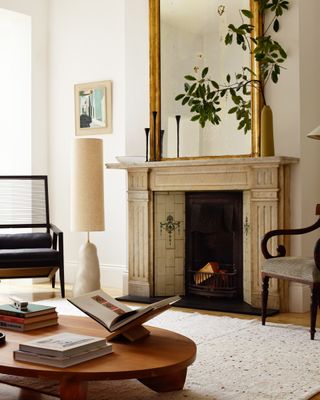 A living room with a large fireplace