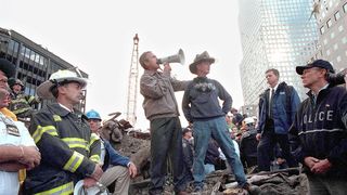 President George W. Bush speaking to first responders atop the rubble at Ground Zero
