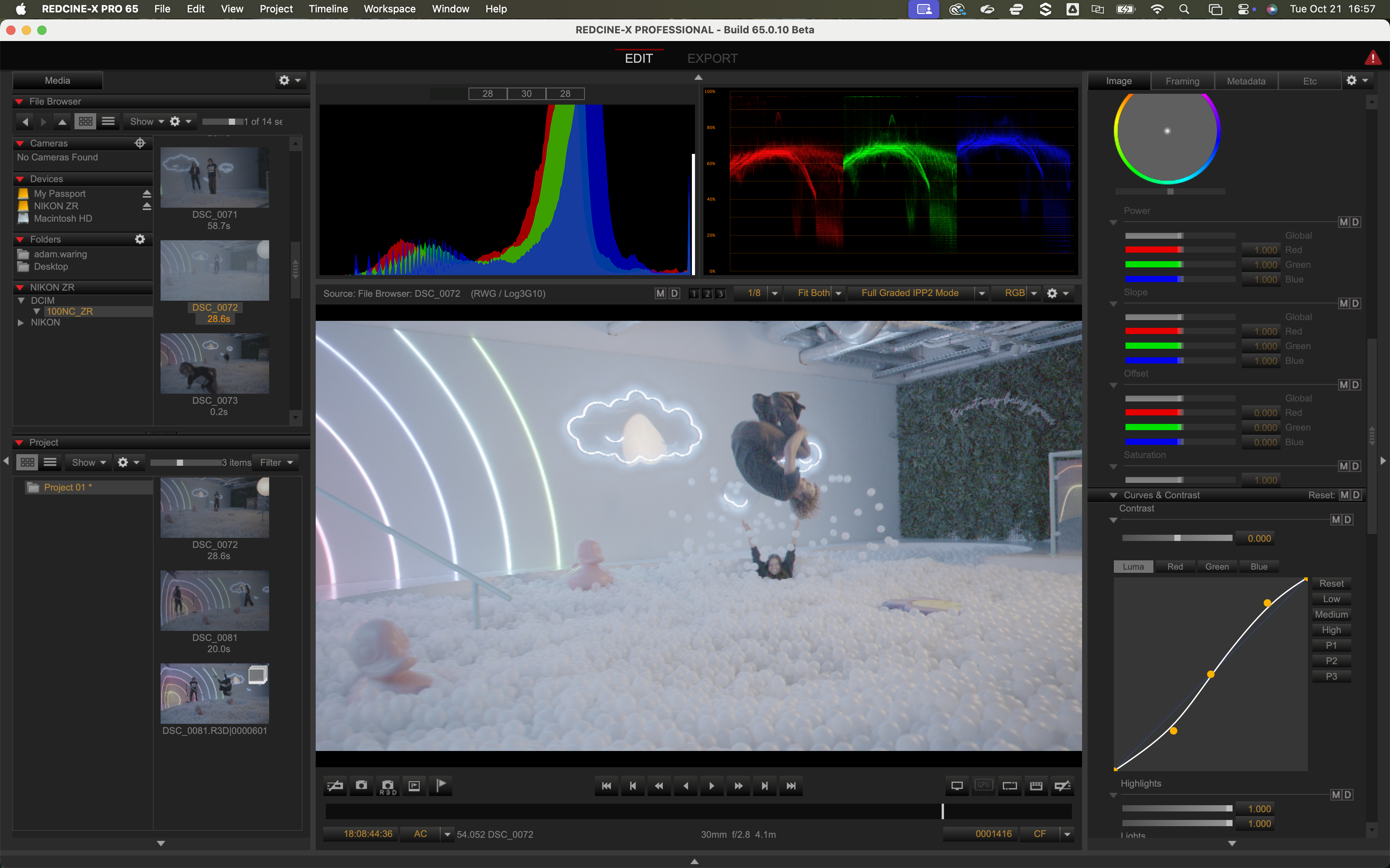 Screenshot of RedCine-X Pro video editing software processing video of people jumping in ball pool shot on a Nikon ZR