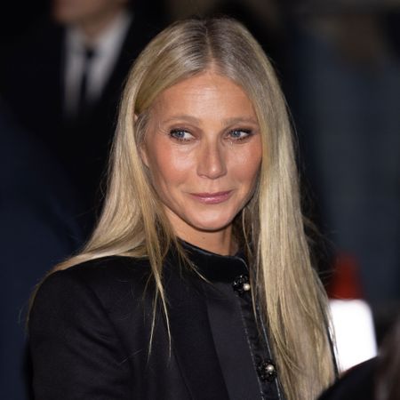 Gwyneth Paltrow looks away from the camera wearing a black jacket 