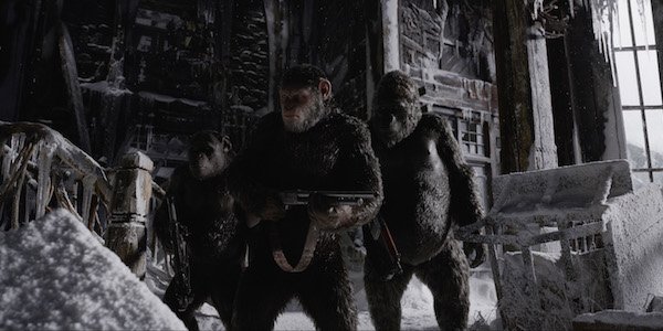 Caesar holding gun in War for the Planet of the Apes