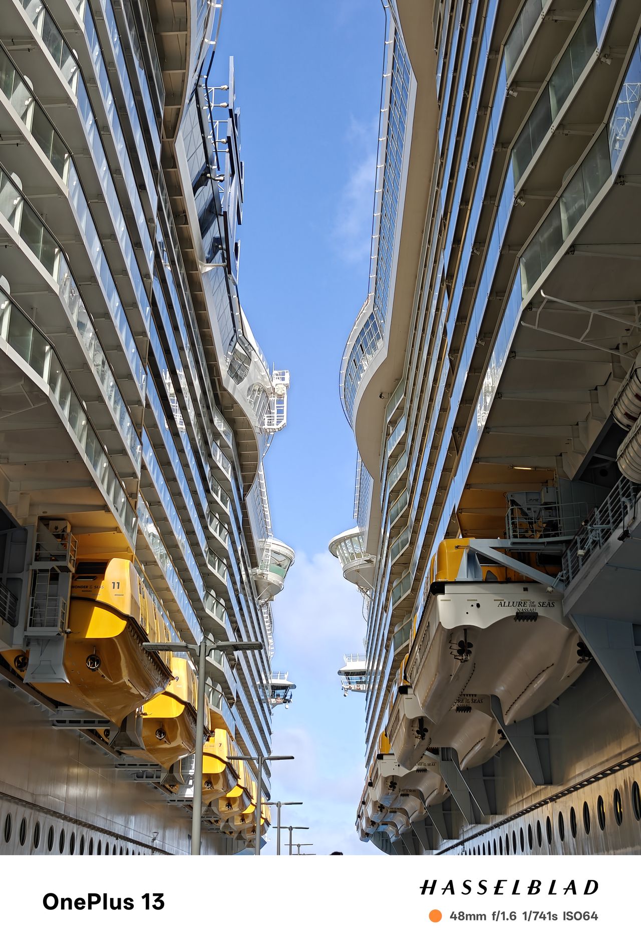 Blue sky between two docked cruise ships