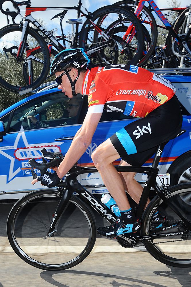 Race leader Chris Froome (Team Sky) drops back to the car