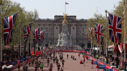 Participants run down The Mall during the 2018 London Marathon in central London