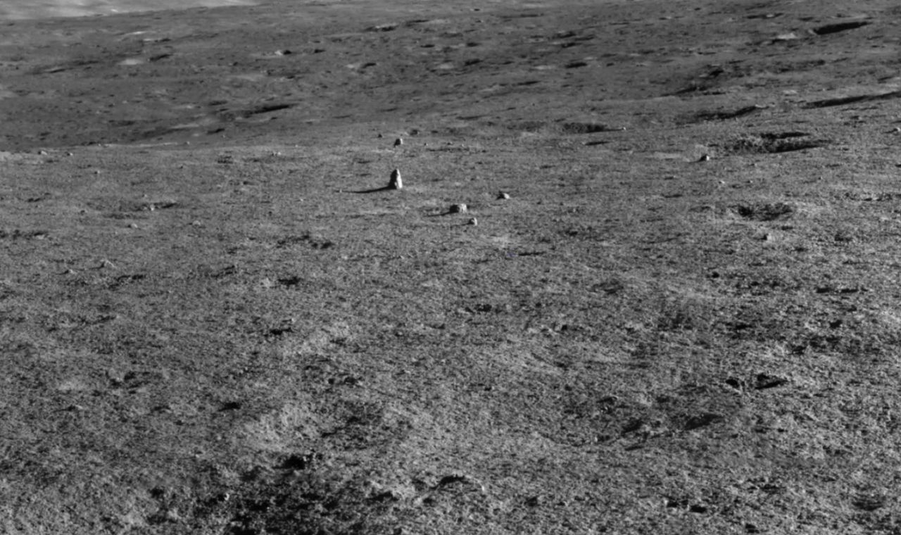 This photo taken by China's Yutu 2 moon rover shows the elongated "milestone" rock on the lunar surface.