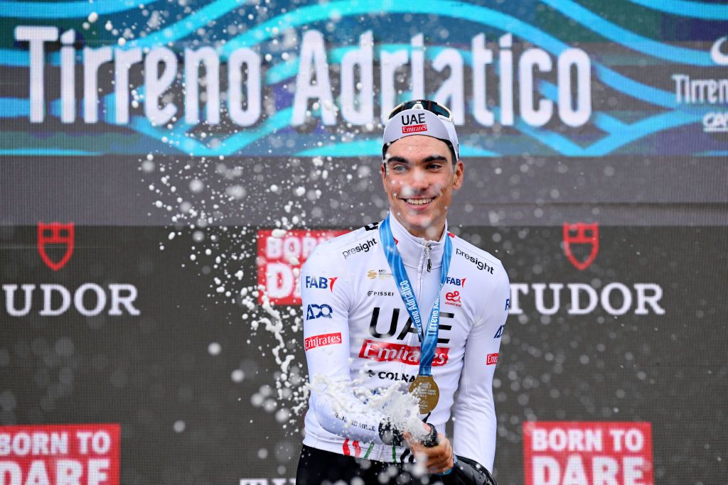 LIDO DI CAMAIORE ITALY MARCH 04 Juan Ayuso of Spain and UAE Emirates Team celebrates at podium as stage winner during the 59th TirrenoAdriatico 2024 Stage 1 a 10km individual trial time from Lido di Camaiore to Lido di Camaiore UCIWT on March 04 2024 in Lido di Camaiore Italy Photo by Tim de WaeleGetty Images