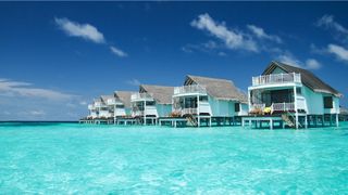 A shot of an island resort in the Maldives owned by Centara Hotels & Resorts