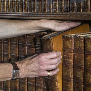 Caroline Bendix, book conservator, pictured at work at Houghton House, Little Houghton, Northamptonshire. ©Mark Williamson / Country Life