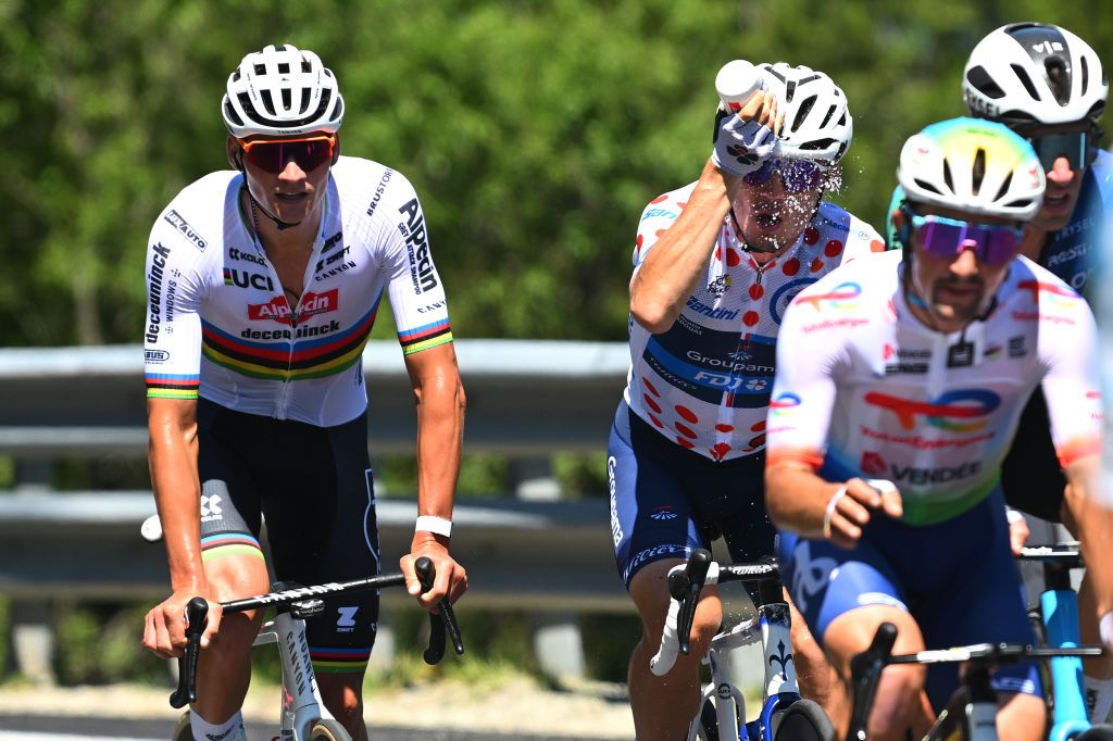 VALLOIRE FRANCE JULY 02 LR Mathieu van der Poel of Netherlands and Team Alpecin Deceuninck and Valentin Madouas of France and Team Groupama FDJ Polka Dot Mountain Jersey compete in the breakaway during the 111th Tour de France 2024 Stage 4 a 1394km stage from Pinerolo to Valloire UCIWT on July 02 2024 in Valloire France Photo by Dario BelingheriGetty Images