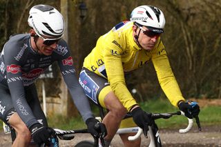 Soudal Quick-Step's Belgian rider Tim Merlier (R) cycles during the 2nd stage of the Paris-Nice cycling race, 183,9 km between Montesson and Bellegarde, on March 10, 2025. (Photo by Anne-Christine POUJOULAT / AFP)