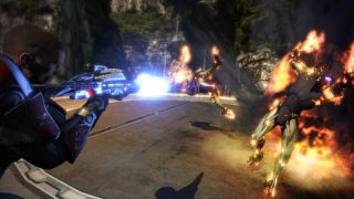 Commander Shepard blasts two enemies while also setting them on fire in Mass Effect