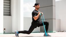 Man doing banded lunges