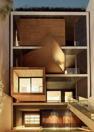 Stacked wooden boxes housing light-filled sitting rooms framing the façade