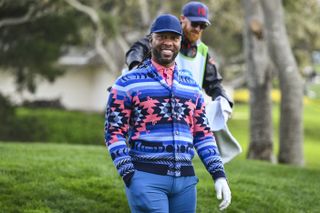 Larry Fitzgerald walks down the fairway at Pebble Beach