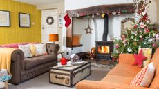 living room with fireplace and charismas tree