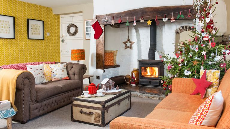 living room with fireplace and charismas tree