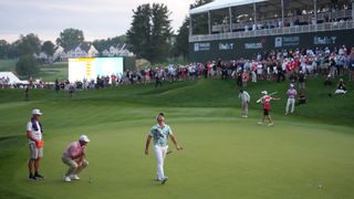 Scottie Scheffler and Viktor Hovland on the 18th green during Round 4 of Travelers Championship 2026 at TPC River Highlands