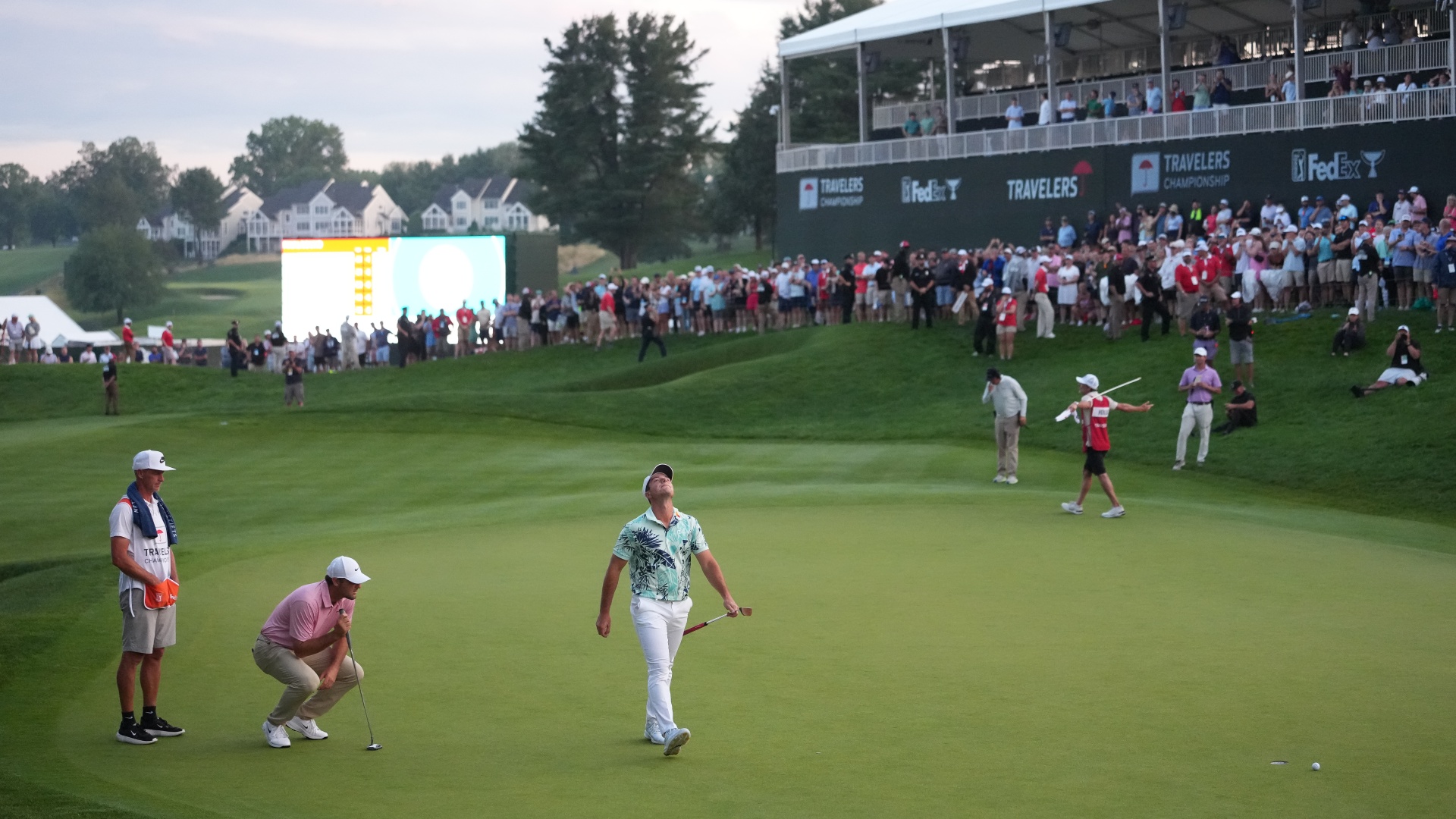 Scottie Scheffler and Viktor Hovland on the 18th green during Round 4 of Travelers Championship 2026 at TPC River Highlands