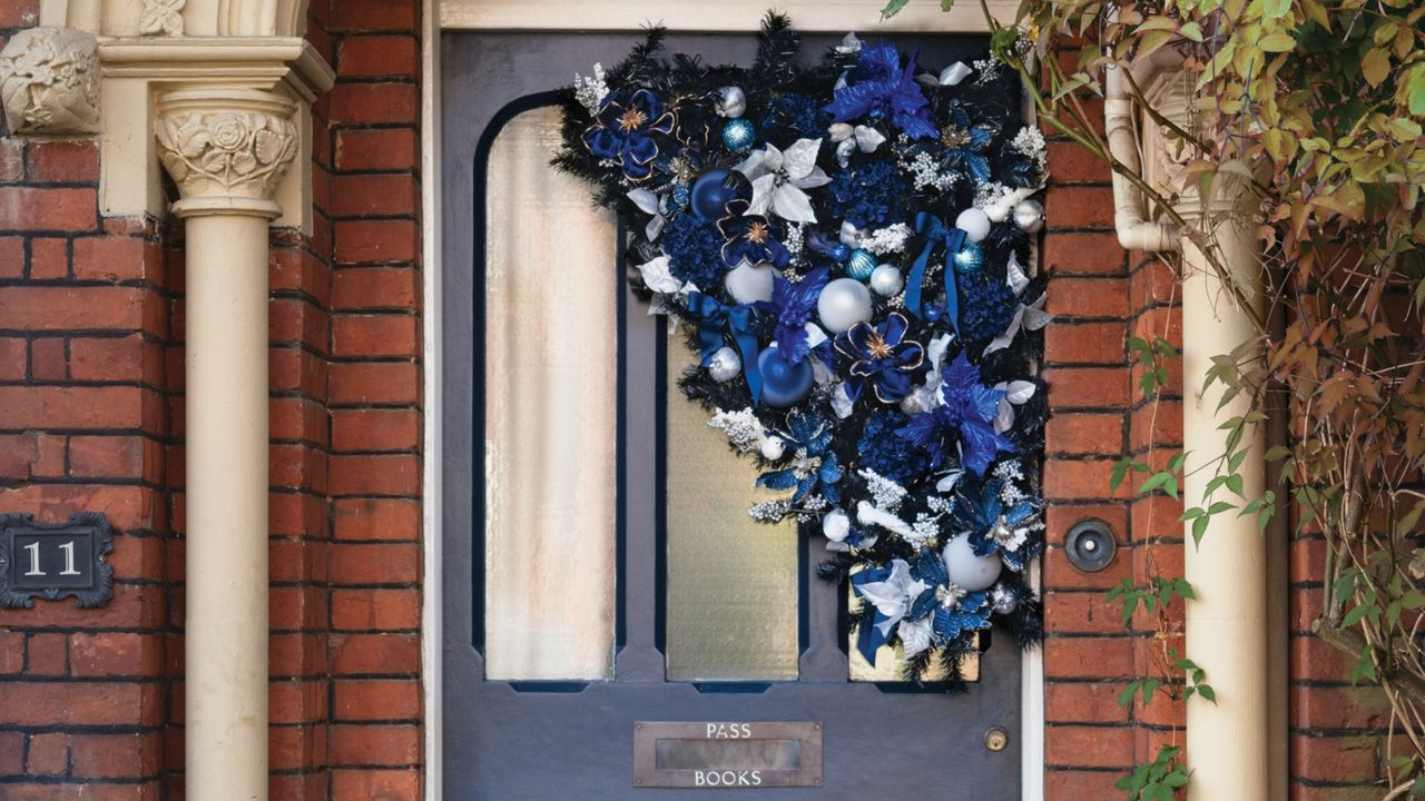 Front door with asymmetrical Christmas wreath