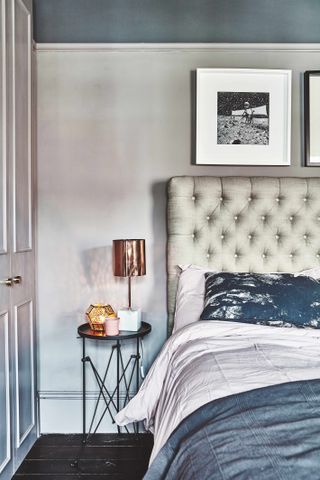 Bedroom with grey button back headboard