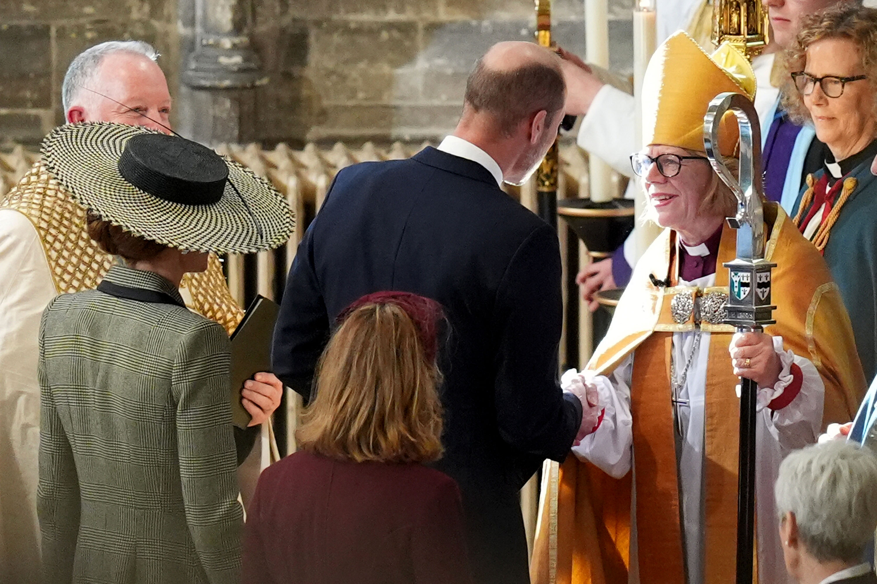 Prince William shaking hands with the Archbishop of Canterbury