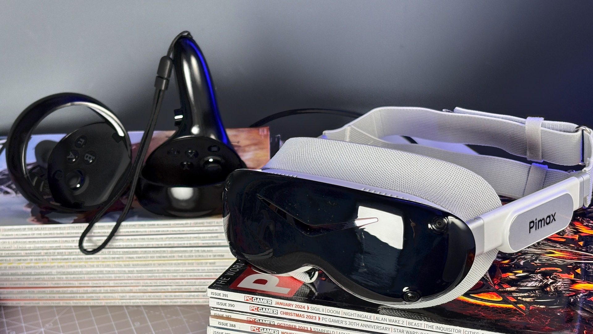 The Pimax Dream Air in white on a stack of PC Gamer magazine.