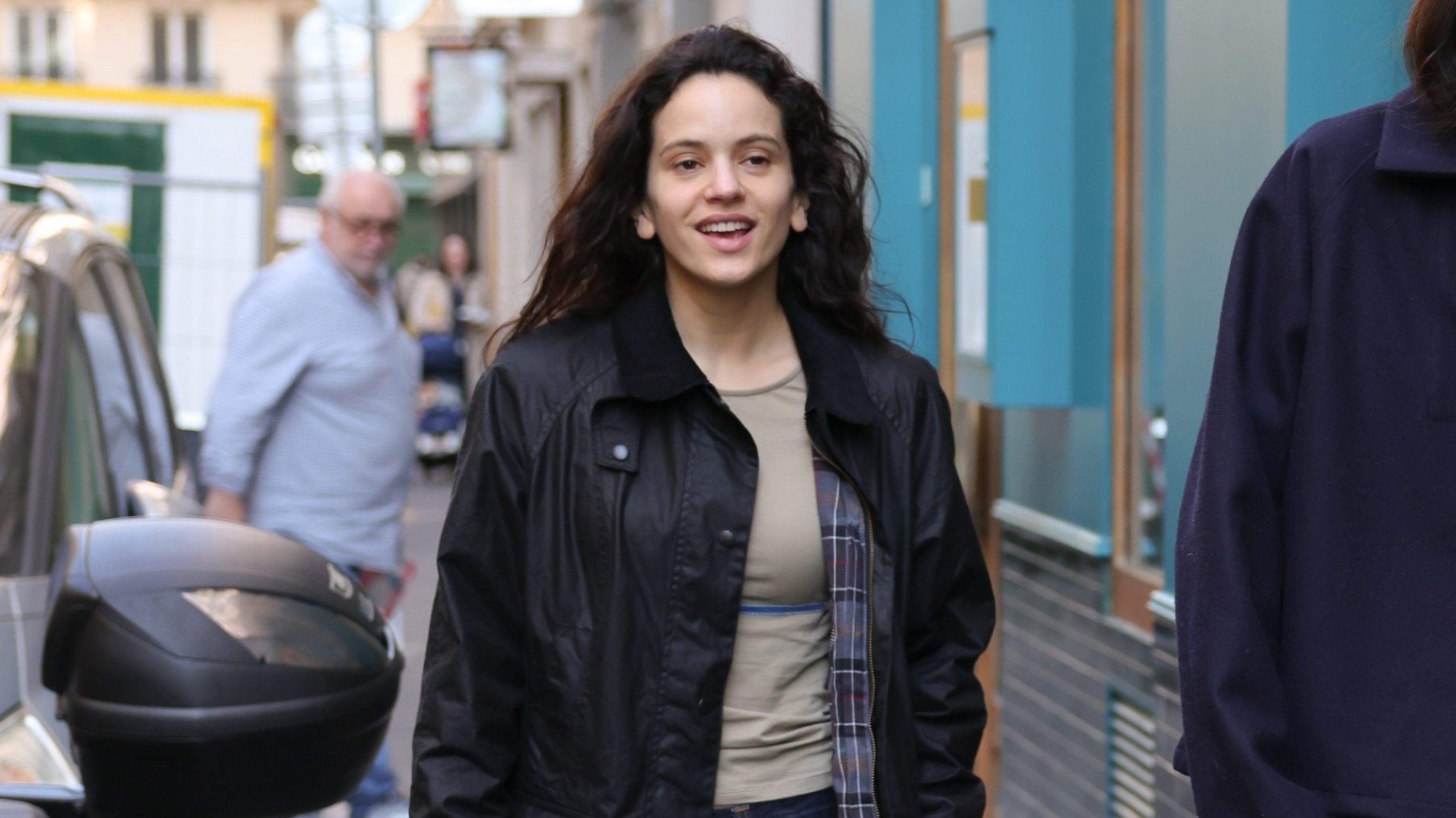 Rosalia wearing a barn jacket, a t-shirt, jeans, and boots while in Paris on March 19