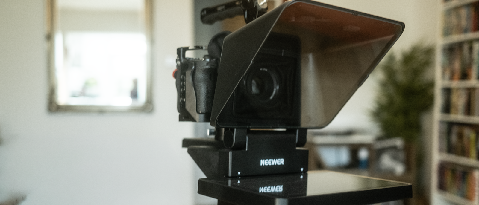 An X11 teleprompter on a tripod